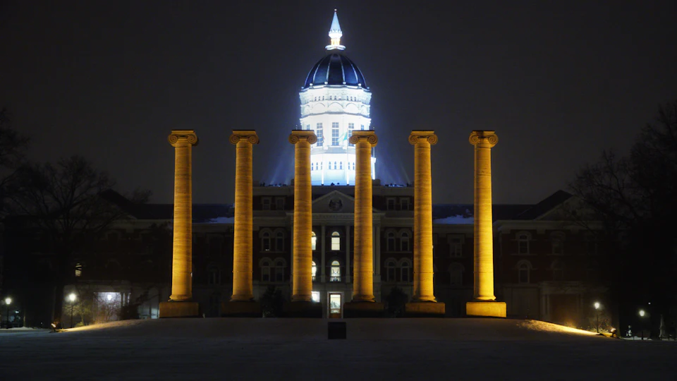 University of Missouri columns illuminated at night